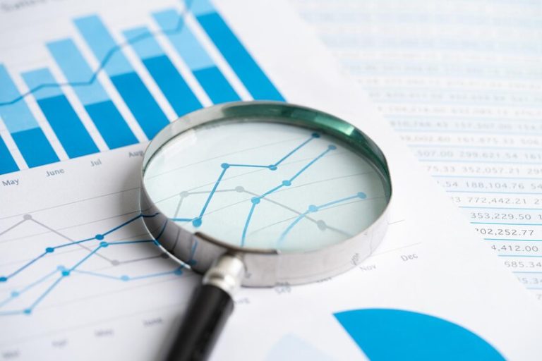 Magnifying glass on graph paper.