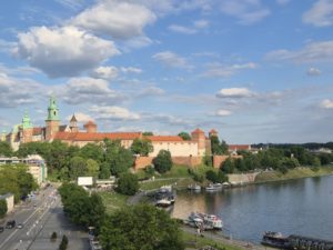 A panoramic view of Krakow, Poland, showcasing historic architecture and vibrant city life.