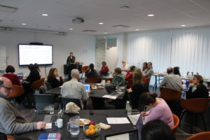 A group of people working on tables